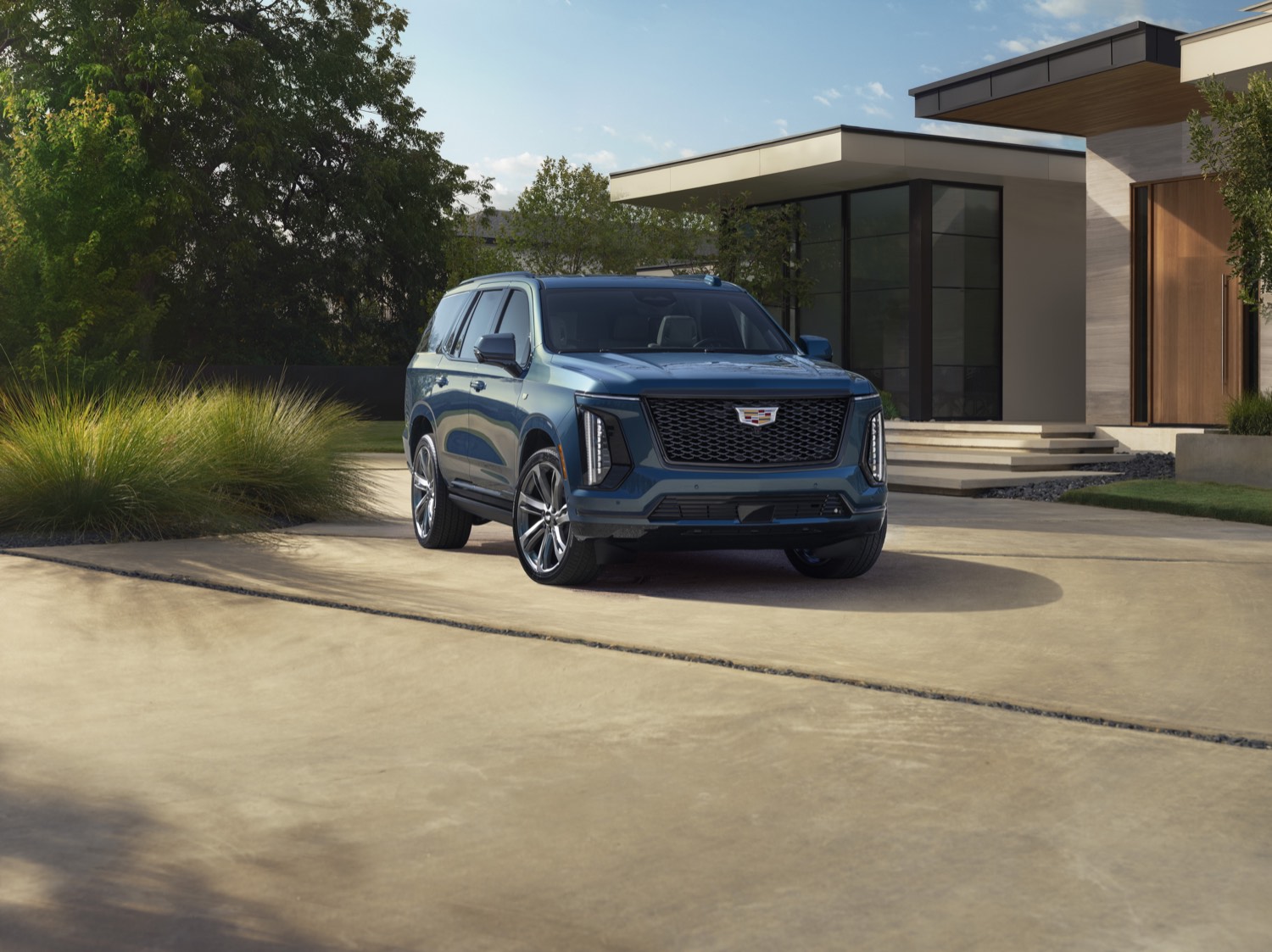 Cadillac Escalade parked on a residential driveway